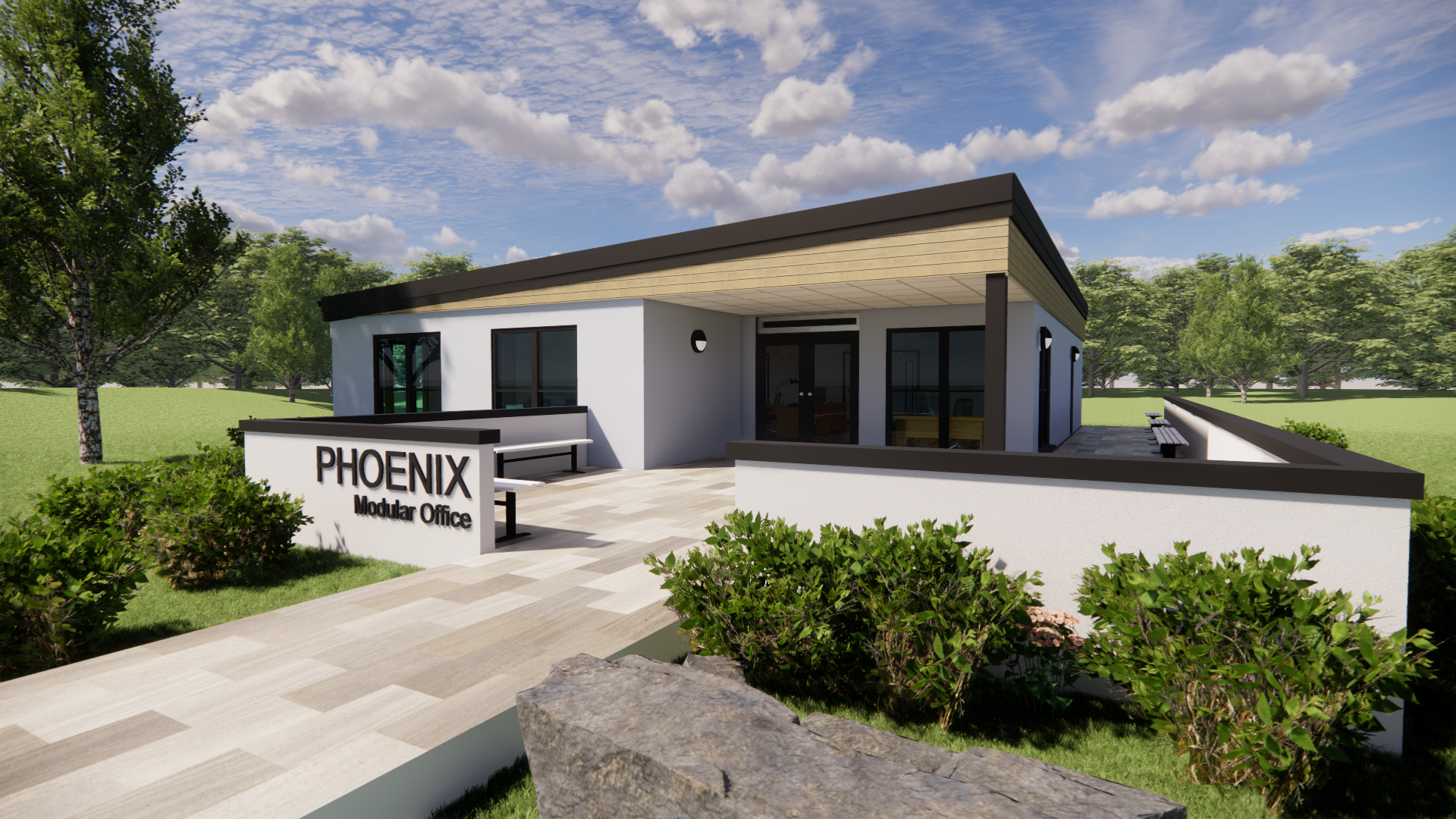 A modern modular office building with large windows and a covered entrance stands amidst green lawns and trees. Text on the building reads, "PHOENIX Modular Office."